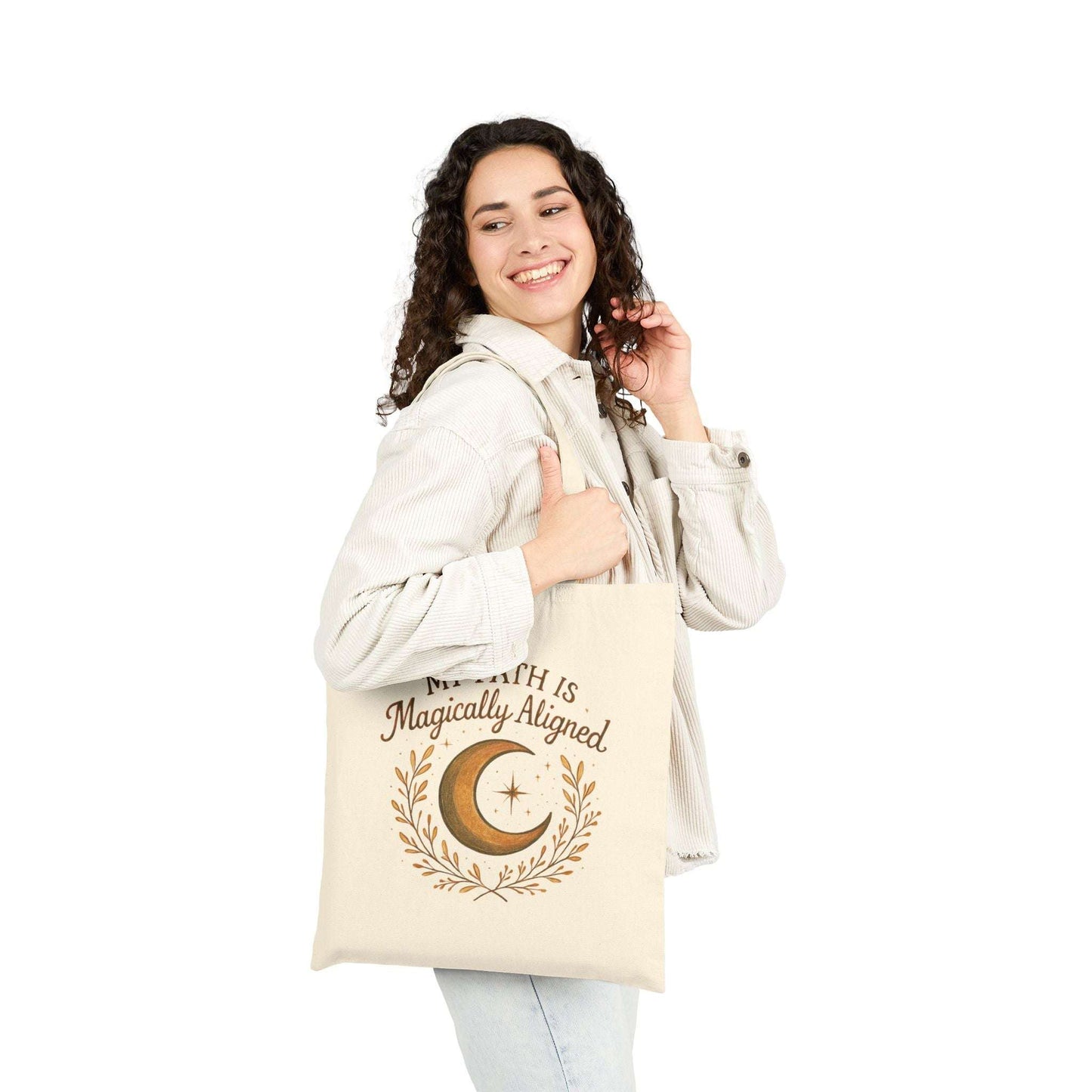 Smiling woman carrying Boho Moon Canvas Tote with celestial design and affirmation text. A stylish, spiritual accessory for yoga, markets, or daily errands.