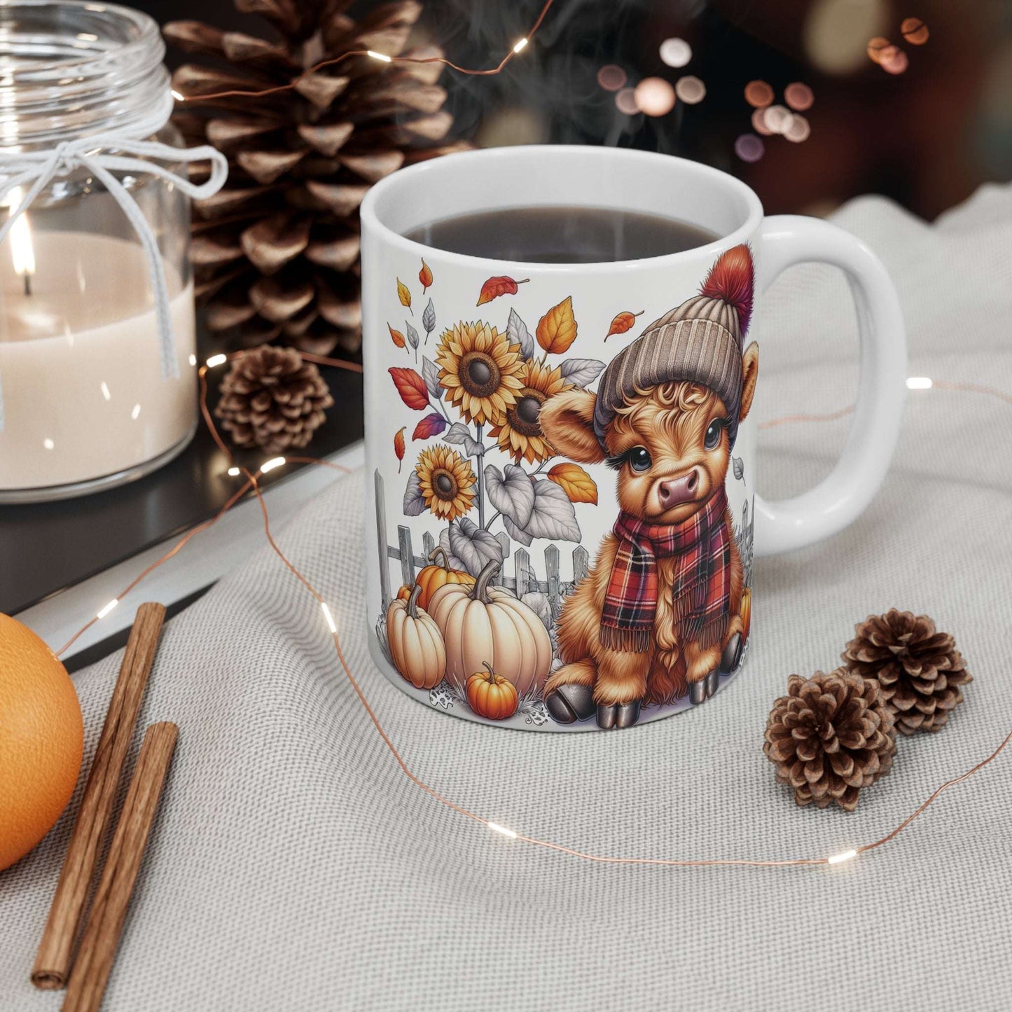 White mug with a cute animal design featuring autumn elements on a decorative table.