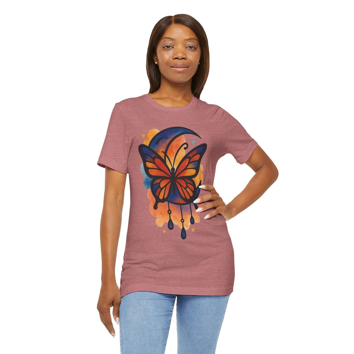 Woman wearing a t-shirt with a colorful butterfly design on a white background