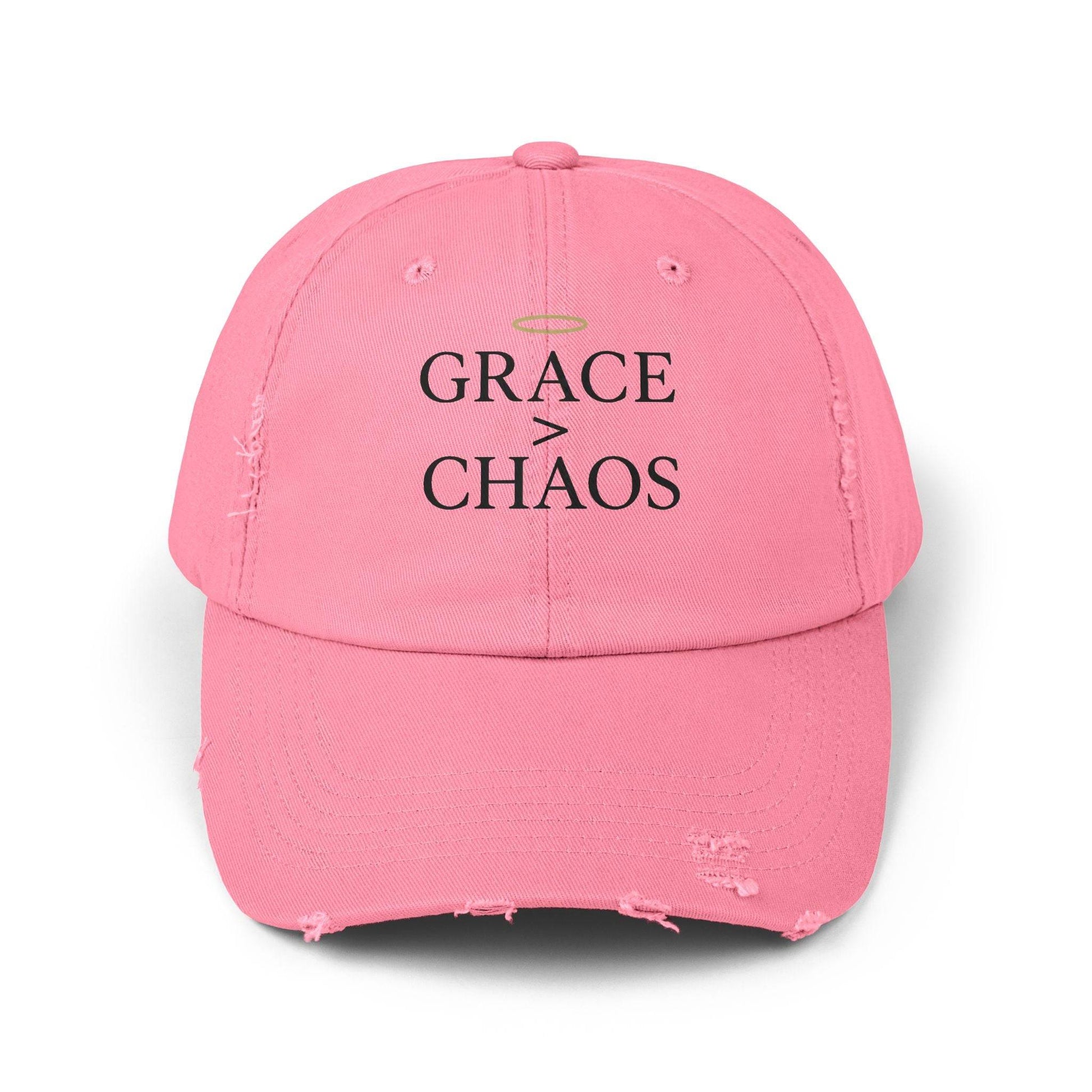 Front view of pink Grace > Chaos Embroidered Distressed Cap with black embroidery and halo icon, ideal for inspirational headwear.