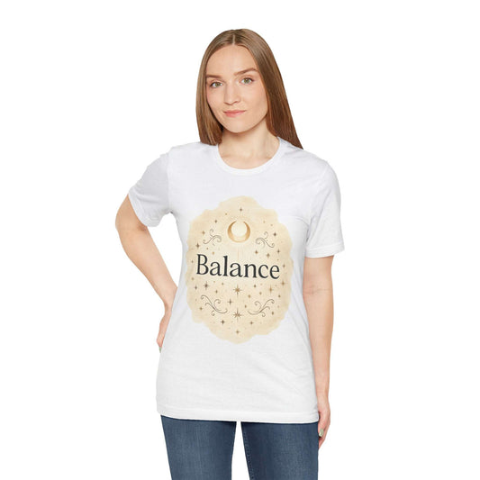 Woman wearing a white t-shirt with 'Balance' design on a plain background