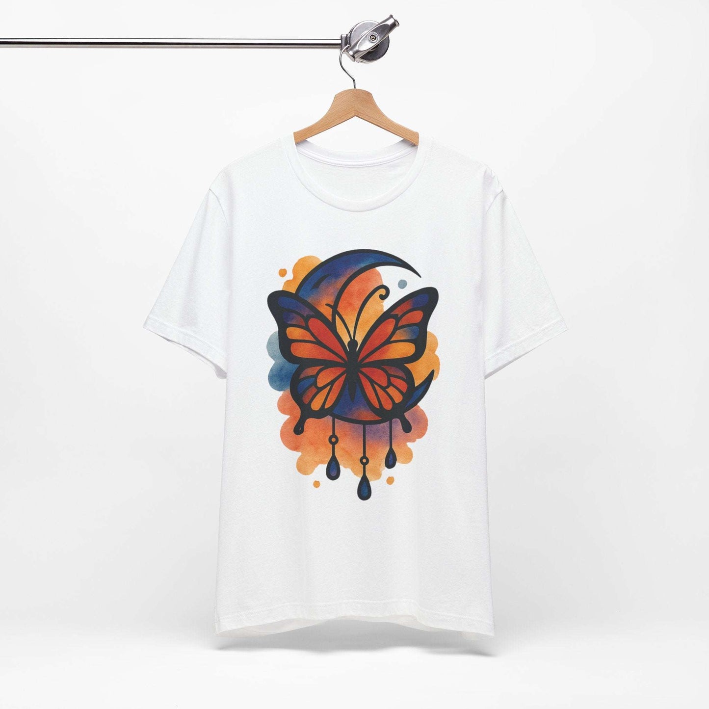 White t-shirt with a colorful butterfly design on a hanger against a white background
