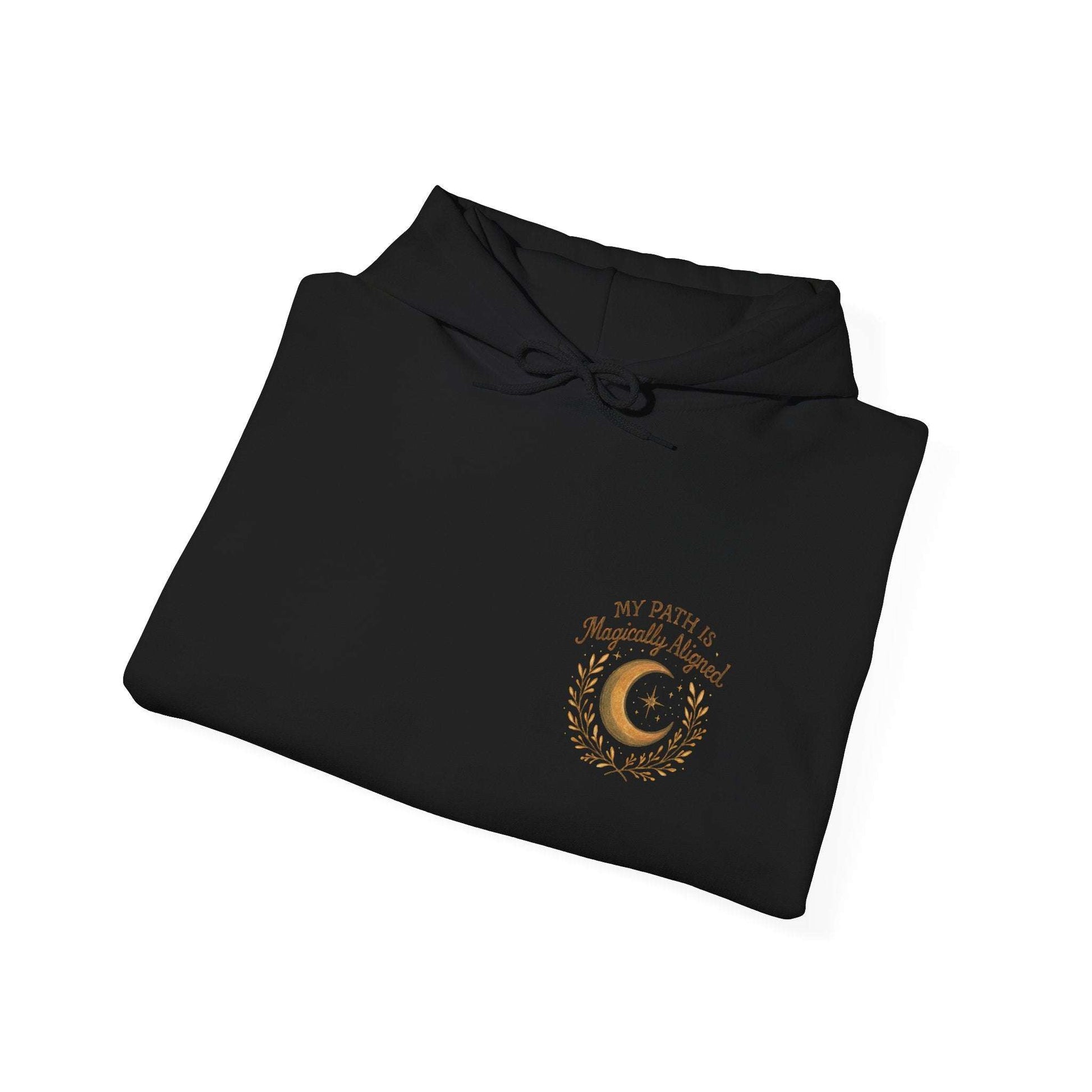 Folded black Aligned Path Moon Hoodie with golden moon and affirmation, ideal for mystic clothing collections and spiritual apparel.