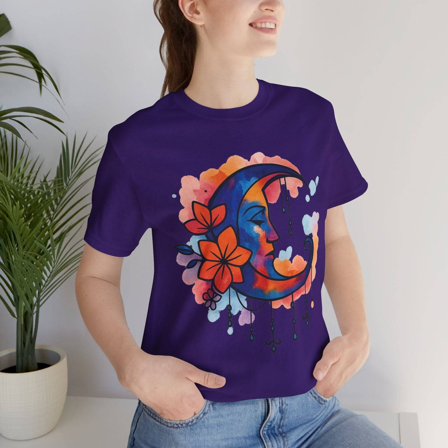 Purple Colorful Boho Crescent Moon T-Shirt featuring a moon goddess face with floral and charm details, perfect for bold, celestial fashion.
