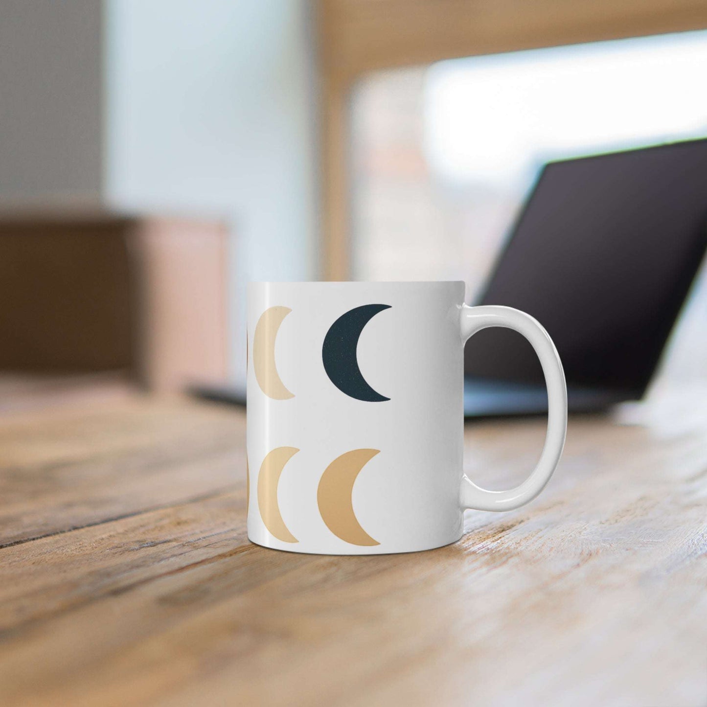 Boho Moon Phase Mug with calming lunar design in neutral tones, placed on a wooden desk for a cozy, aesthetic home and lifestyle vibe.