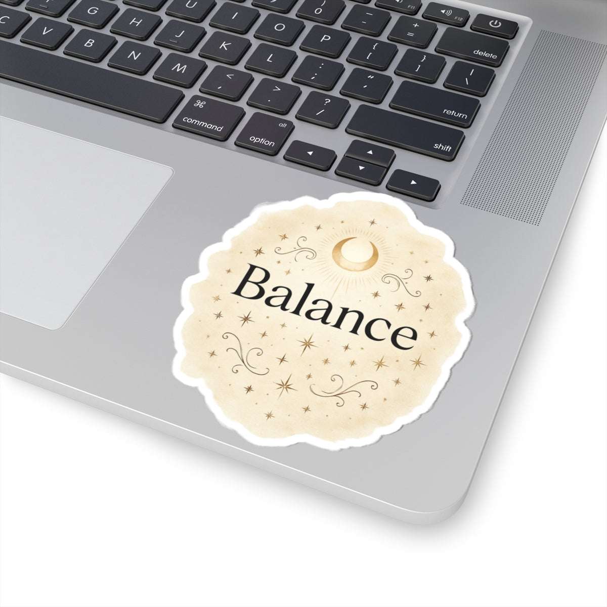 Balance themed round sticker placed on a neutral background, featuring elegant gold floral accents and inspirational typography.”