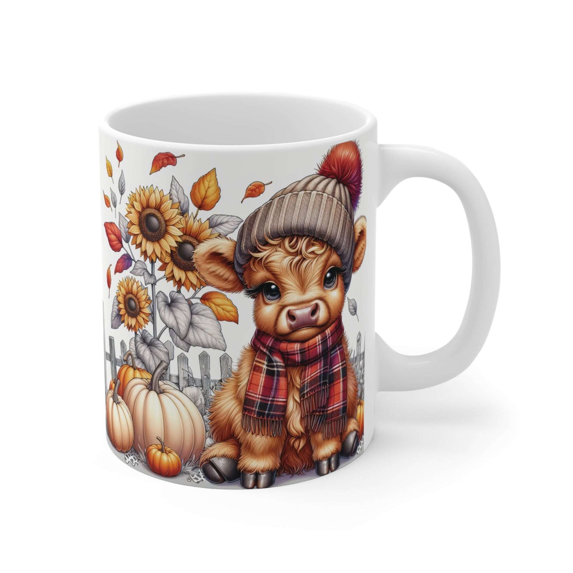 Mug with a cartoon cow wearing a hat and scarf, surrounded by autumn elements on a white background.