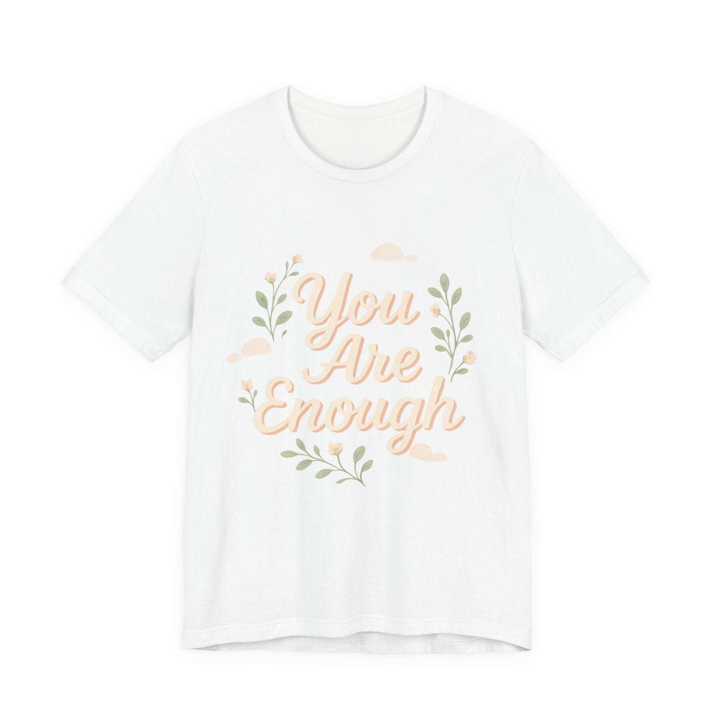 White Floral Tee You Are Enough Unisex Jersey featuring soft pink script and leafy accents, laid flat for product display.