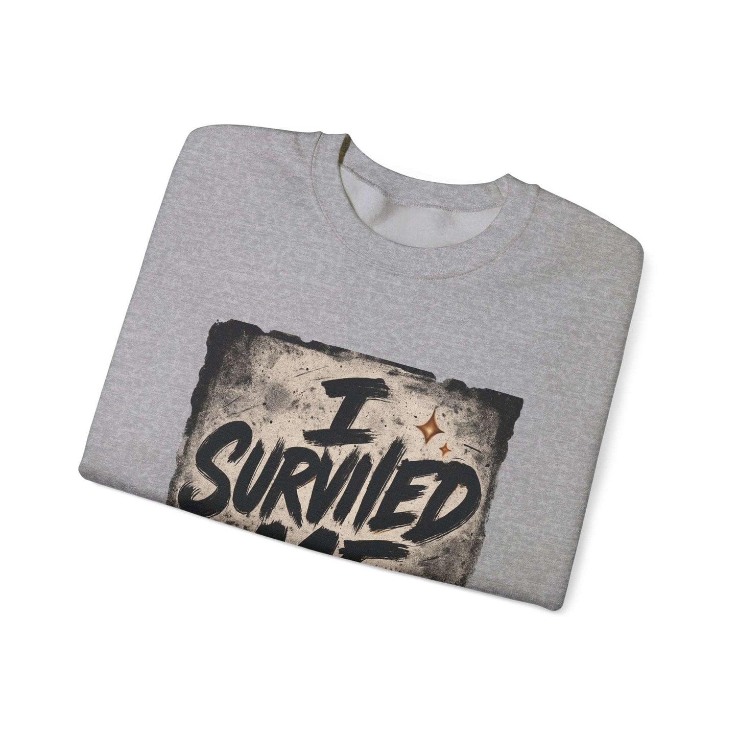 Folded gray Survived Me Sweatshirt with bold grunge print, combining comfort and resilience in casual apparel.