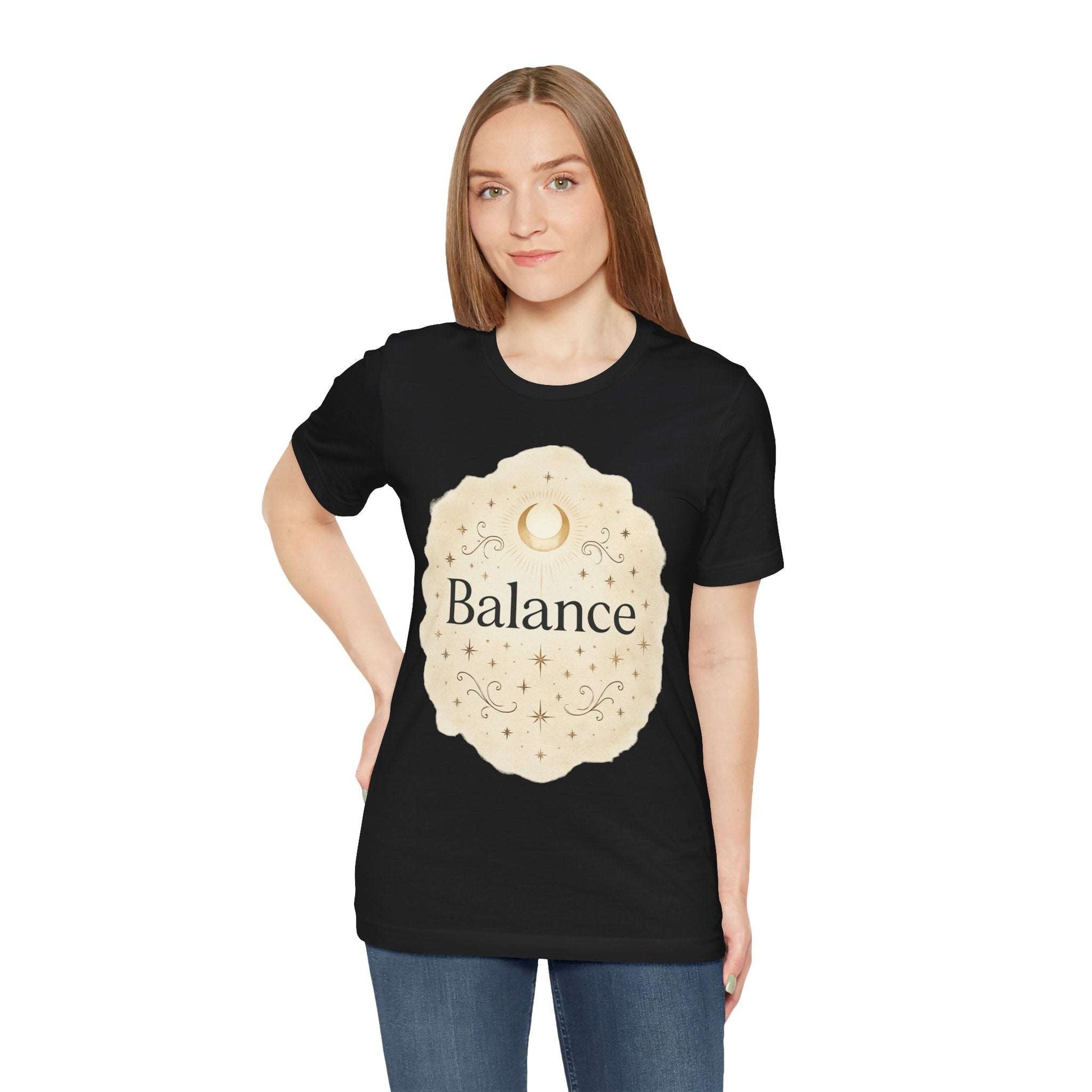Person wearing a black t-shirt with 'Balance' design on a white background