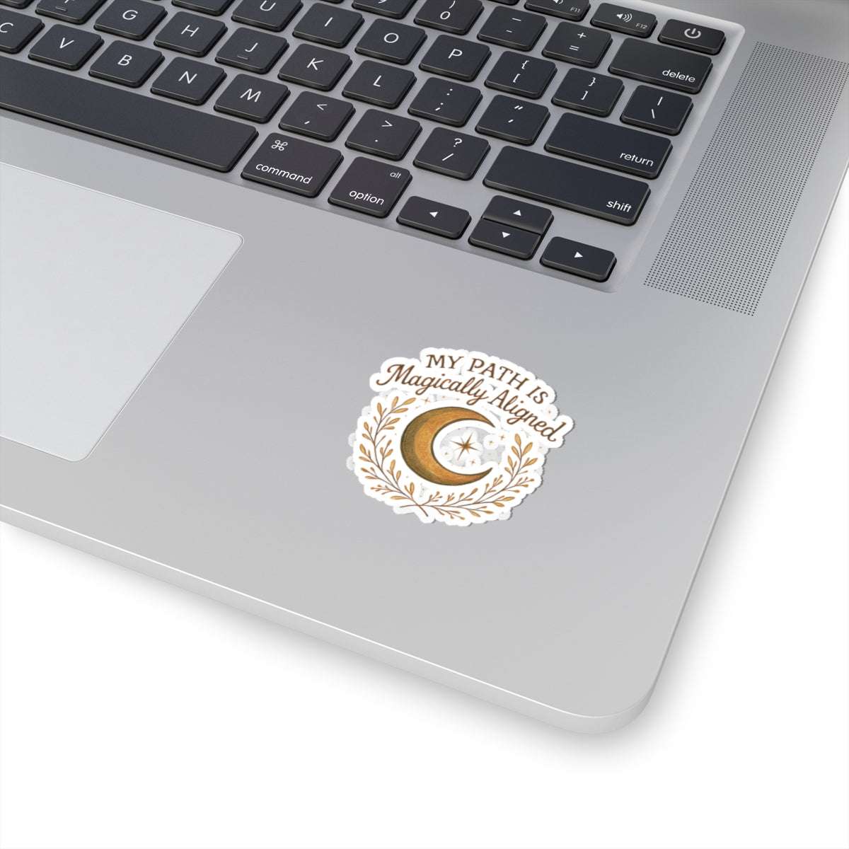 Glossy crescent moon sticker with magical affirmation on laptop, ideal for spiritual self-care and boho-inspired tech personalization.