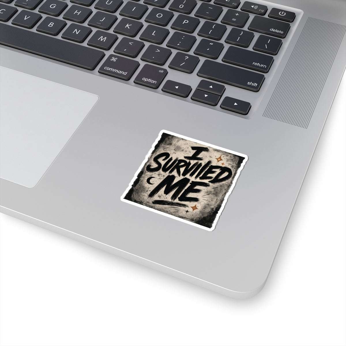 Small 'I Survived Me' sticker on a laptop, perfect for subtle self-expression and motivational flair in everyday tech use.