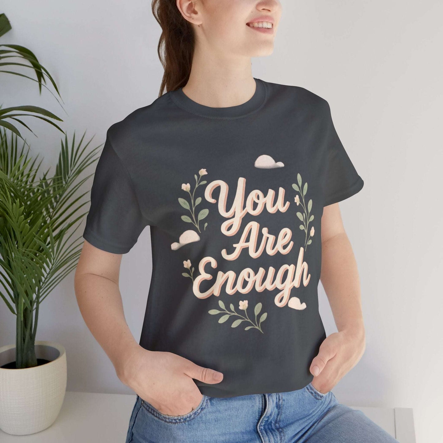 Dark gray Floral Tee You Are Enough Unisex Jersey modeled with jeans, emphasizing breathable cotton and floral artwork.