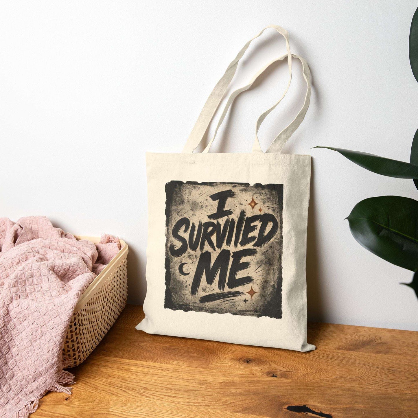 Inspirational beige tote bag with 'I Survived Me' print displayed on a wooden surface, perfect for self-love and resilience gifting.