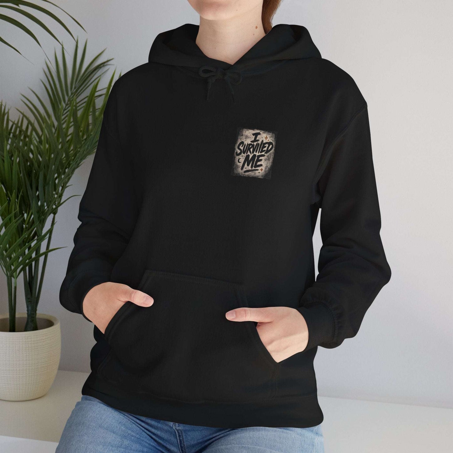Black I Survived Me Hoodie with bold survival quote graphic, grunge fashion style for resilience and self-love in casual loungewear.