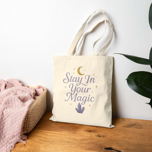 Neutral canvas tote bag with motivational quote ‘Stay in Your Magic,’ eco-friendly reusable shopping bag for daily use, spiritual lifestyle accessory.