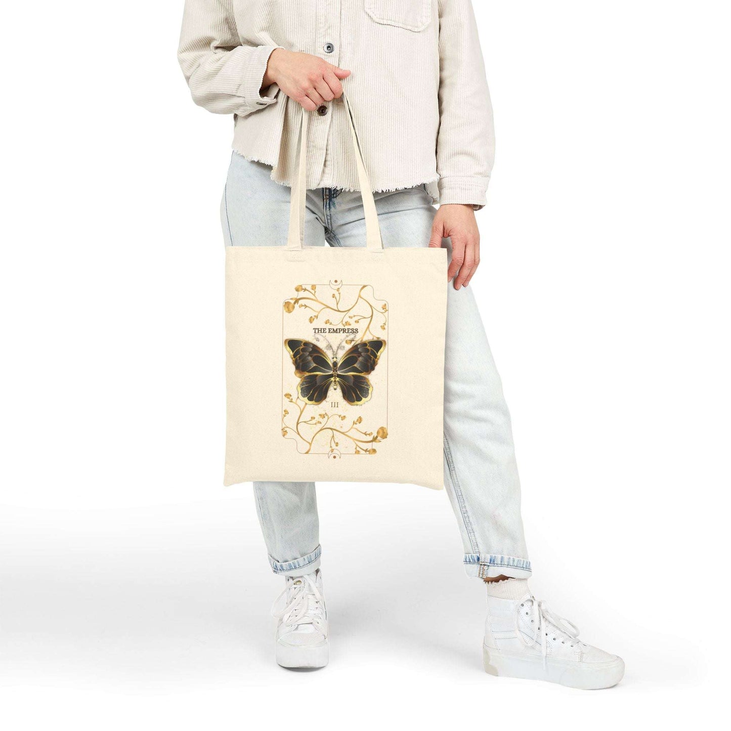 Model holding Butterfly Botanical Tote Bag with vintage butterfly tarot design, a stylish eco-friendly accessory for boho and nature-inspired outfits.