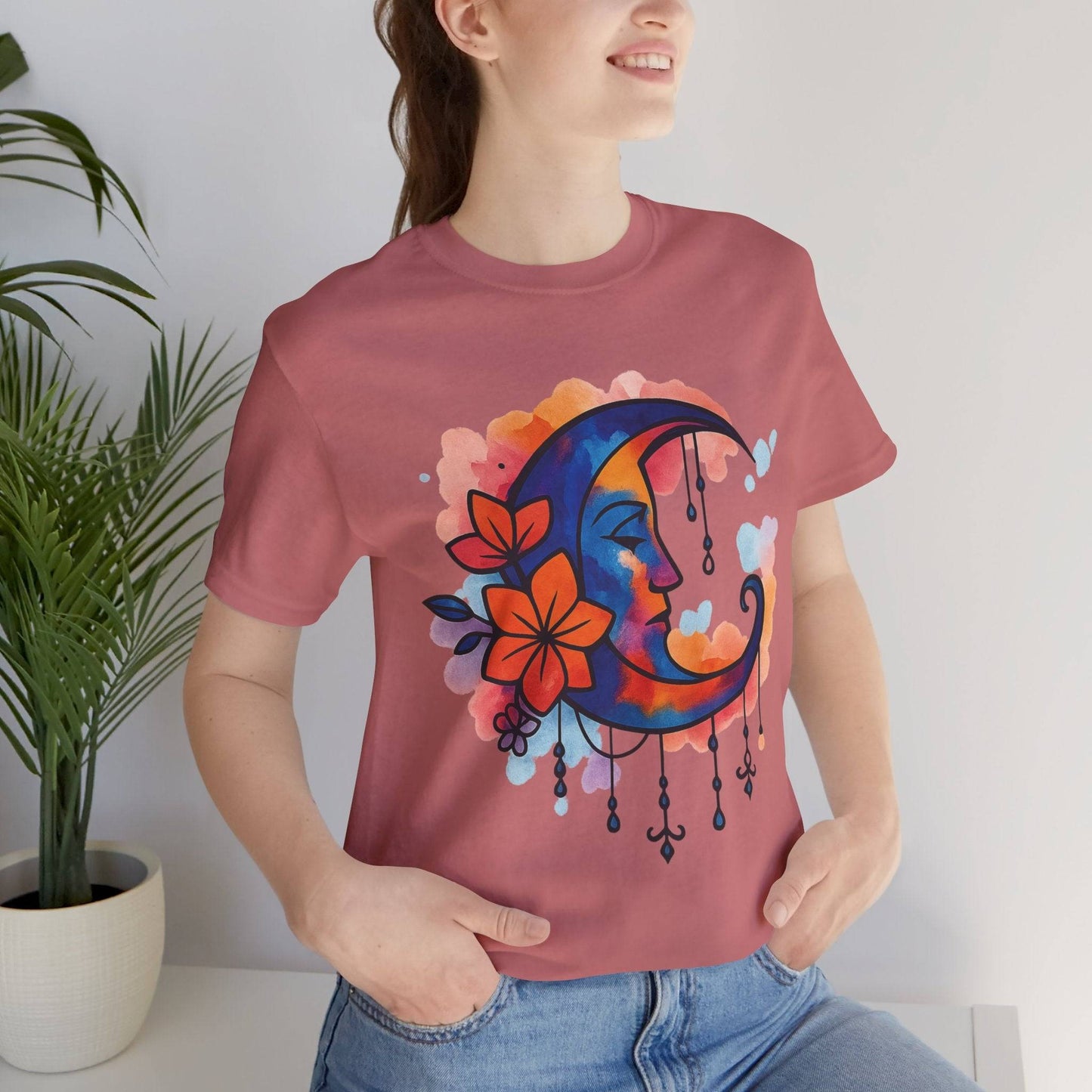 Mauve Floral Moonface Goddess Tee with vibrant crescent moon and flower print, a soft boho t-shirt for casual and artistic fashion lovers.