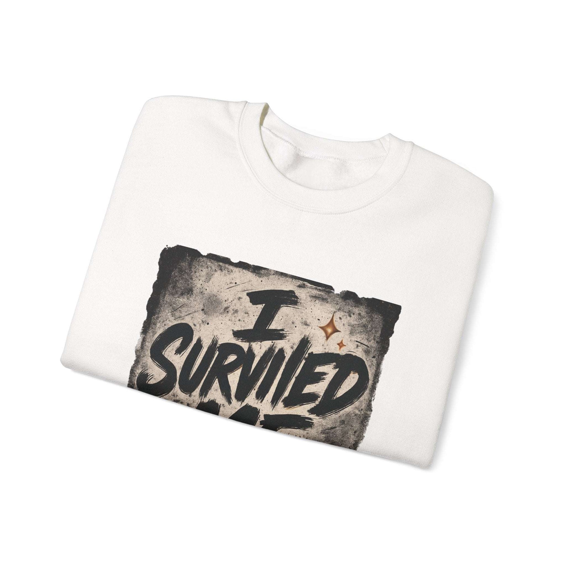 Folded white Survived Me Sweatshirt with distressed inspirational print, perfect for self-love and survivor-themed fashion.