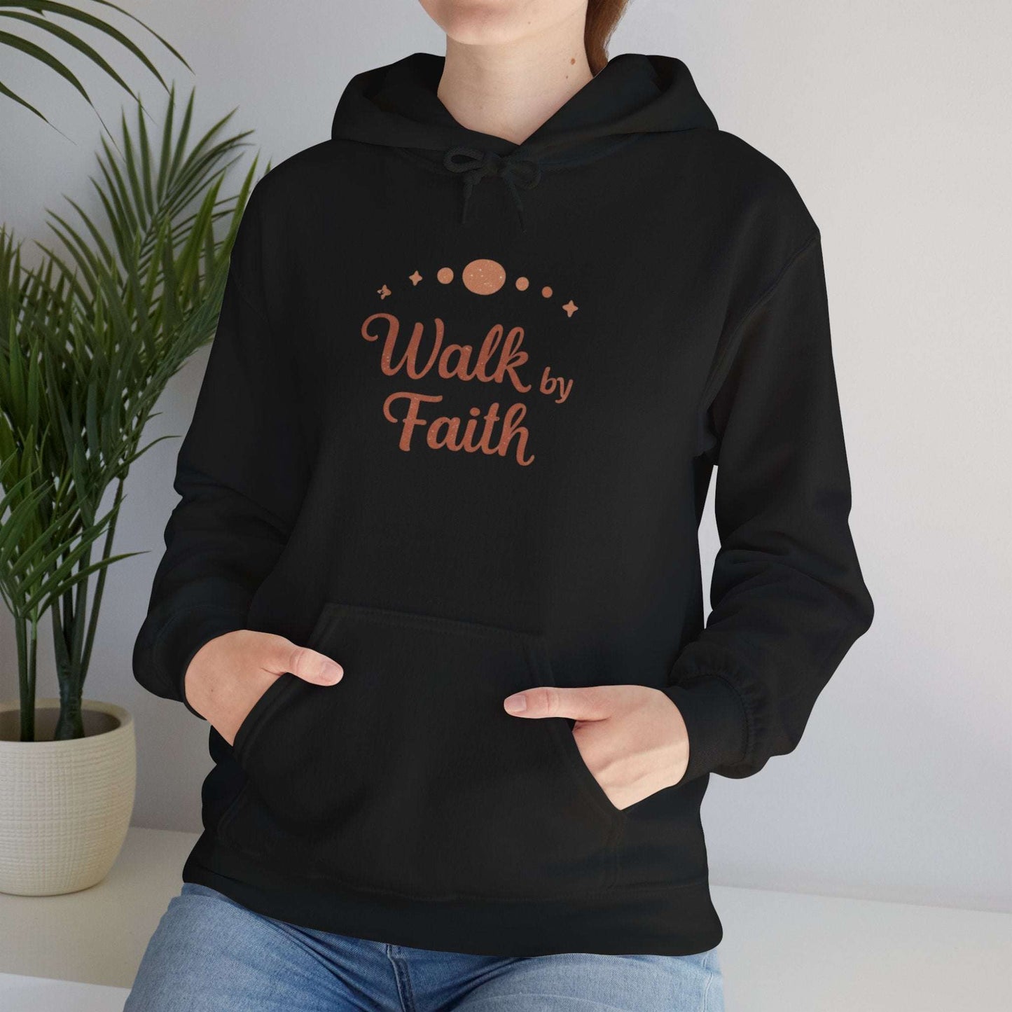 Black Faithful Walk Hoodie modeled indoors, highlighting 'Walk by Faith' spiritual design for Christian activewear.